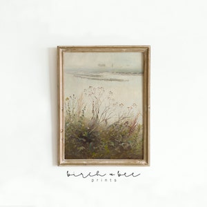 May include: A framed painting of a foggy landscape with a river and tall grasses in the foreground. The painting is in a light brown frame with a white mat.