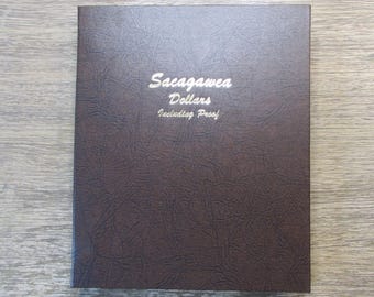Dansco album for Sacagawea Dollars with proof issues - vintage album