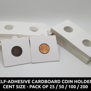May include: White self-adhesive cardboard coin holders for cents. The holders have circular cutouts to display the coins. Two coins are visible, one brown and one copper. The text at the bottom reads: SELF-ADHESIVE CARD COIN HOLDERS, CENT SIZE - PACK OF 25 / 50 / 100 / 200.
