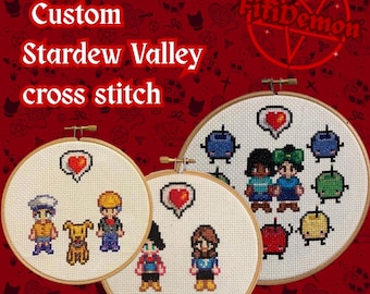 May include: Three circular wooden embroidery hoops containing Stardew Valley cross stitch designs on white fabric. The designs feature pixelated characters, a dog, and colourful fruit icons with heart symbols. Text reads Custom Stardew Valley cross stitch.