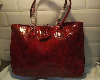 Large red vinyl tote bag