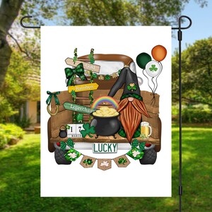 May include: A green, white, and brown gnome with a red beard is sitting in the back of a brown pickup truck. The truck is decorated with shamrocks, a rainbow, and a pot of gold. The truck has a license plate that says "LUCKY".
