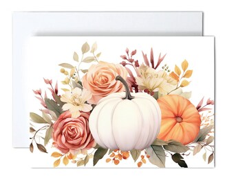 May include: A set of note cards with envelopes. The cards feature a watercolor design of a white pumpkin, an orange pumpkin, and peach-colored roses. The text "Note Cards Set of 10 with Envelopes" is printed at the bottom.