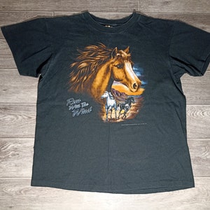 May include: Black t-shirt with a graphic of a brown horse running with the wind. The text "Run with the Wind" is printed on the shirt.