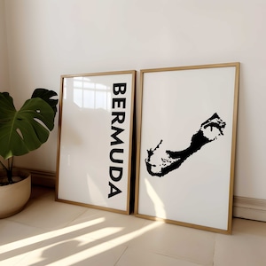 May include: Two framed prints with a white background and black text and image. The print on the left says "BERMUDA" in black text. The print on the right shows a black silhouette of the island of Bermuda.