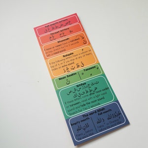 May include: A multi-coloured bookmark featuring Arabic script and English explanations. The bookmark is segmented into sections with titles such as "Full mouth letters" and "Ghunnah", with corresponding Arabic characters and phonetic guides.