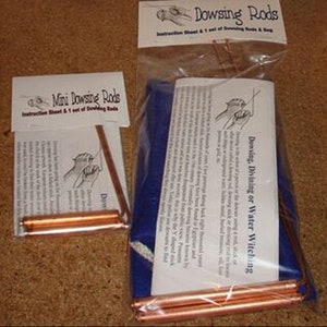 May include: Two sets of copper dowsing rods, one set is mini and the other is full size. Both sets come with instruction sheets and are packaged in clear plastic bags. The full size set is packaged with a blue cloth bag. The instruction sheet for the full size set includes the text "Dowsing, Divining or Water Witching".