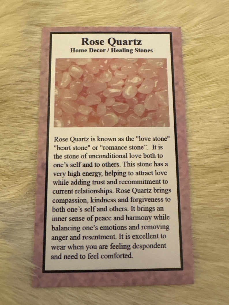 May include: A card with the text "Rose Quartz Home Decor / Healing Stones" and a photo of pink rose quartz stones. The card also includes text describing the properties of rose quartz, known as the "love stone".