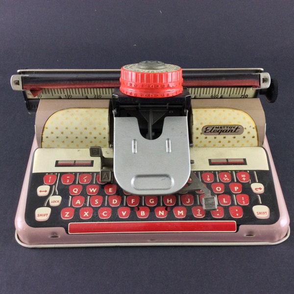 Macchina da scrivere vintage giocattolo Mettoy Elegante collezione da ufficio in scatola stagnata degli anni '60 Junior, prodotta nel Regno Unito
