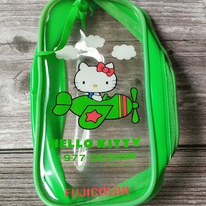 Bolsa vintage de Hello Kitty: Fujicolor verde transparente con cremallera