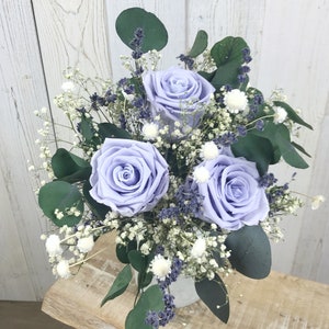 Bouquet of dried and preserved flowers, with eternal roses and dried lavender, bridal bouquet of eternal flowers