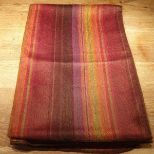 Cuddly soft blanket made of baby alpaca wool, shades of red, harmoniously striped, woven unique
