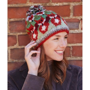 Hand knitted 100% sheep wool knitted bobble beanie. Orange foxes on a green, red and grey background. Stocking stitch with rib hem. Fleece lined around the forehead.