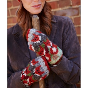 May include: A pair of red, green, and gray knitted mittens with a fox pattern. The mittens have a brown leather tag with a logo on them.