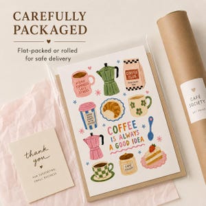 May include: A rectangular art print featuring colorful illustrations of coffee-related items, including mugs, a moka pot, a croissant, and a slice of cake, with the text "COFFEE IS ALWAYS A GOOD IDEA" and a small "thank you" card in a clear sleeve.