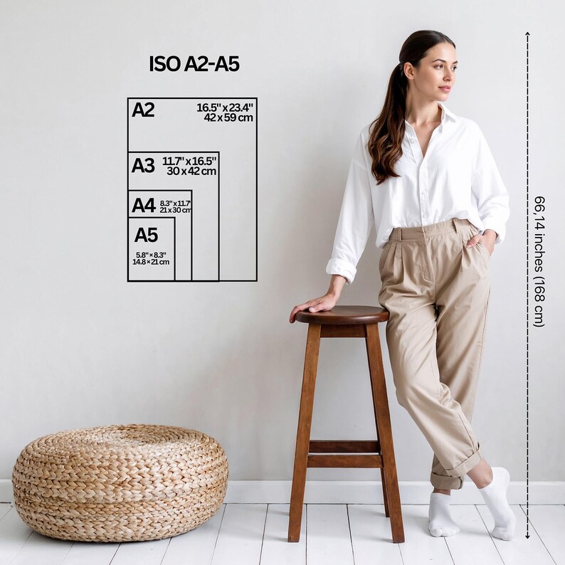 A woman stands near a wooden stool and a woven ottoman. A chart on the wall displays ISO A2-A5 paper sizes, with measurements in inches and centimetres. The height is marked as 168 cm.