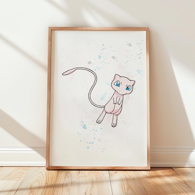 Framed Mew print leaning against white wall with soft lighting – Pokémon Mew print displayed in a minimal interior setting with sunlight creating shadows.