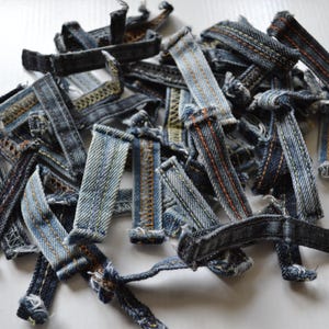 50 pcs. colored denim belt loops, Jeans are redesigned.