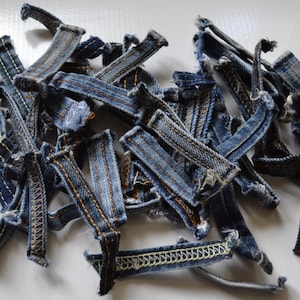 50 pcs. colored denim belt loops, Jeans are redesigned.