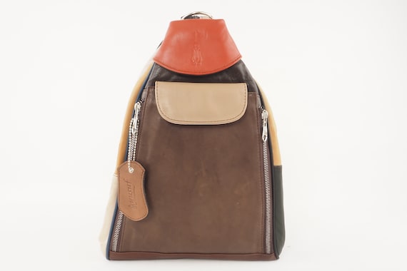 brown leather backpack with black shoes Tan on the farm Colors:Indigo Blue carrier height: 27