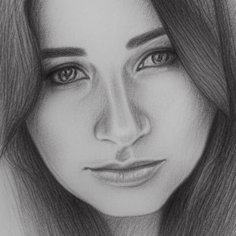 May include: A black and white pencil drawing of a woman's face. The woman has long dark hair, and her eyes are looking directly at the viewer. Her lips are slightly parted, and she has a soft expression on her face.