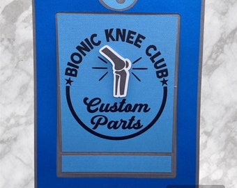 May include: A blue card with a white circle and the text "Bionic Knee Club Custom Parts". Inside the circle is a gray illustration of a knee.