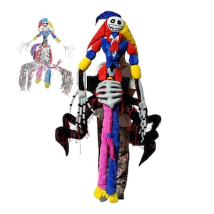May include: A plush toy inspired by a colourful drawing, featuring a jester hat in red, blue, and yellow, a skeletal torso, and multiple long, spindly black limbs. The character has a white face with a wide, toothy grin and yellow eyes.