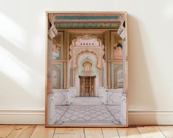 May include: A framed photograph of a colorful, ornate doorway with intricate arches and a tiled floor. The doorway is decorated with painted designs and leads into a room with a similar style.