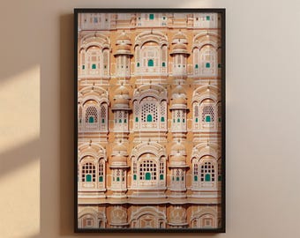 May include: A close-up view of a building with intricate details and many windows. The building is a pale orange color with white trim and green accents. The windows are arched and have a lattice design.