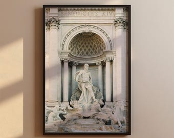 May include: A black and white photograph of the Trevi Fountain in Rome, Italy. The fountain features a large statue of Oceanus, the god of the sea, surrounded by other sculptures. The inscription "BENEDICTUS XIV" is visible above the archway.