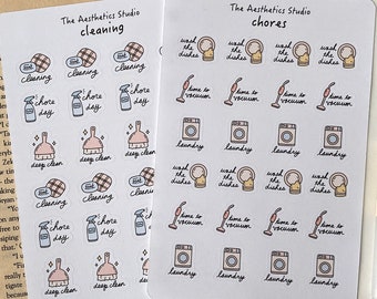 May include: Two sheets of stickers with illustrations of household chores. The first sheet is titled "The Aesthetics Studio cleaning" and features stickers of cleaning supplies, a broom, and the text "chore day". The second sheet is titled "The Aesthetics Studio chores" and features stickers of a vacuum cleaner, a washing machine, and the text "wash the dishes".