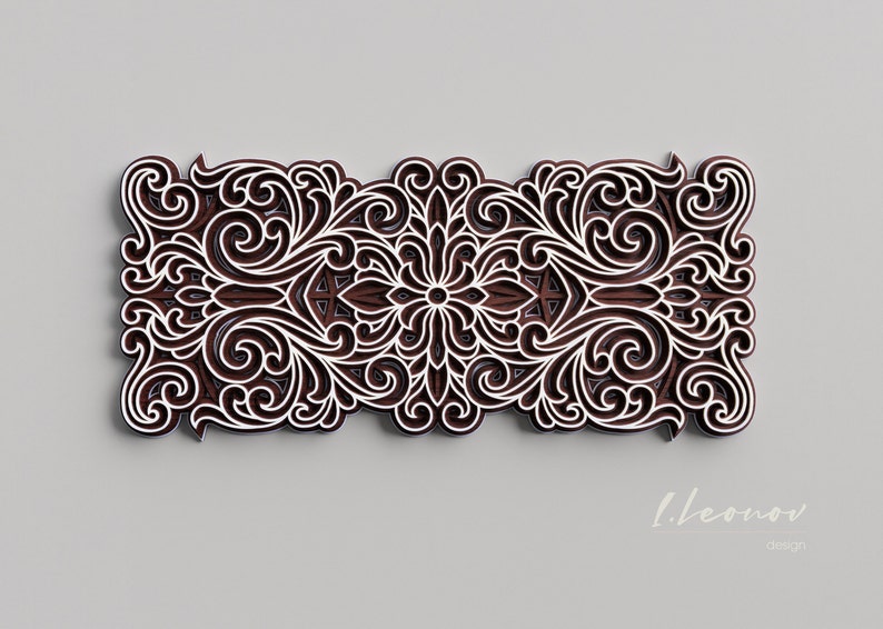 May include: A brown wooden decorative wall art piece with a white intricate floral design. The design features a central flower with swirling patterns and leaves.