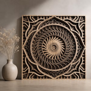 May include: A square wooden wall art piece featuring a multi-layered mandala design with intricate, swirling patterns in shades of dark and light brown wood, displayed next to a light-colored ceramic vase containing dried, delicate beige flowers.