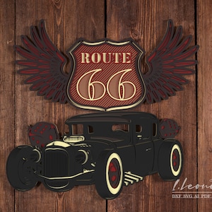 May include: A black hot rod with red and gold Route 66 wings. The car has a black body, chrome wheels, and a red and gold Route 66 sign on the front.