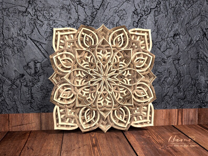 May include: A detailed wooden mandala with intricate cutouts, creating a geometric pattern. The mandala is light brown and has a symmetrical design.