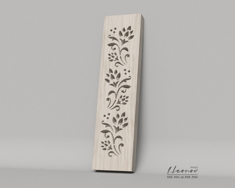 May include: A wood panel with a decorative floral design cut out. The design features a repeating pattern of stylized flowers and leaves.