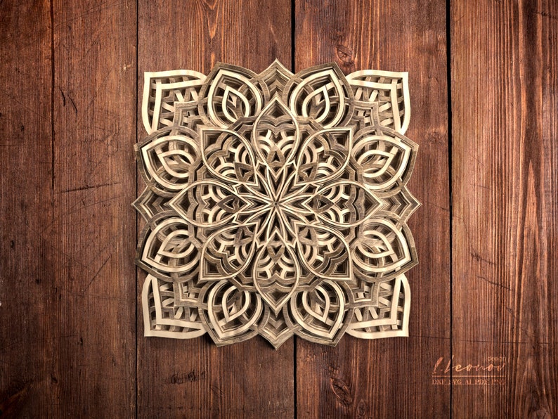 May include: A detailed, intricate wooden mandala with a layered, geometric design. The mandala is made of light brown wood and has a symmetrical pattern.
