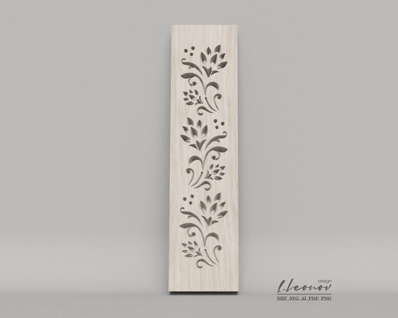 May include: A vertical wood panel with a decorative cutout design featuring a repeating pattern of stylized floral motifs. The design is cut out of the wood, creating a delicate and intricate pattern.