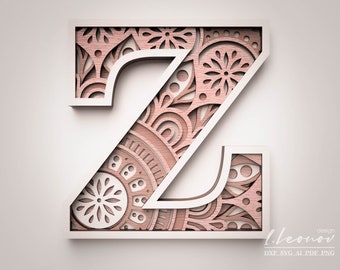 Może przedstawiać: Biała litera Z z różowym i białym wzorem mandali w środku. Litera jest wycięta z wzoru mandali, tworząc efekt 3D.