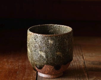Woodfired yunomi tea bowl. Grey glaze floral press design yunomi. Wheelthrown tea bowl made from local clay. Handmade pottery teaware.
