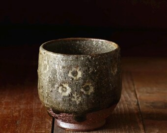 Woodfired yunomi tea bowl. Greyish glaze floral inlay design yunomi. Wheelthrown tea bowl made from local clay. Handmade pottery teaware.