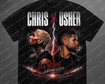 May include: Black t-shirt featuring a graphic of Chris Brown and Usher with the text "CHRIS X USHER" above their portraits. The design includes a lightning bolt and the words "R&B LEGENDS". The shirt has a vintage, distressed look.