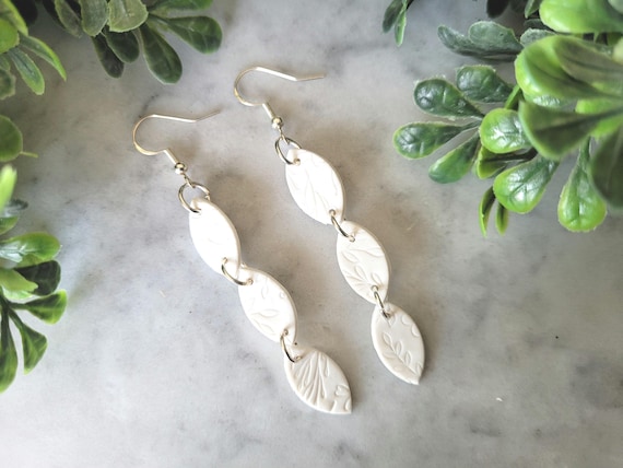Long White Floral Clay Earrings.