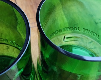 May include: Two green glass tumblers with the words "John Jameson" and "1780" etched on the bottom.