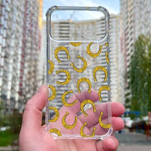 Custodia per telefono con ferro di cavallo portafortuna, cover trasparente portafortuna per iPhone 17 16 15 Pro Max, custodia trasparente con motivo giallo portafortuna.