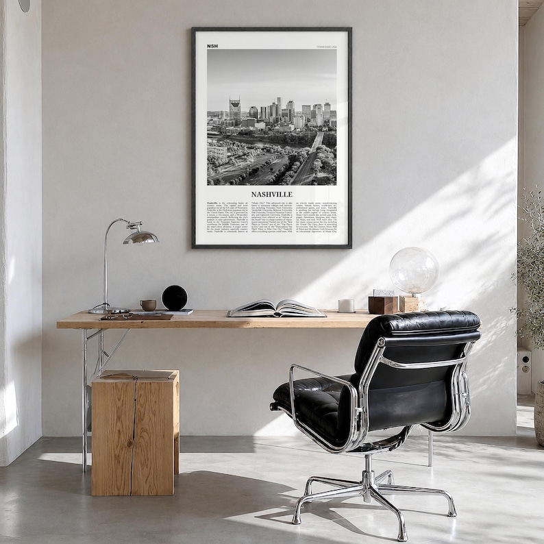 Nashville Poster, black and white skyline photo print in a black wood frame, hanging in a bright home office