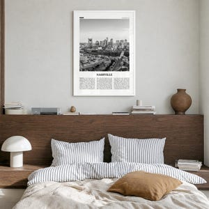 Nashville Poster, black and white skyline photo print in a white wood frame, hanging in a bedroom