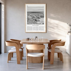 Nova Scotia Poster, black and white photo print in a natural wood frame, hanging in a dining room