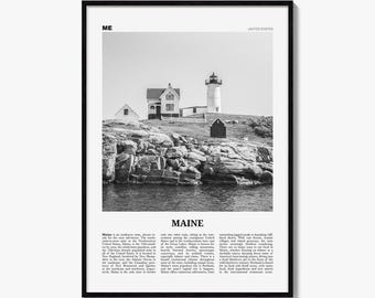 May include: A black and white framed wall art print featuring a lighthouse and coastal buildings on a rocky shore. The text ME and UNITED STATES appears at the top, with the word MAINE and descriptive text about the state at the bottom.