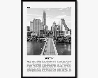 May include: A black and white framed wall art print featuring a cityscape of Austin, Texas. The image shows a bridge leading toward skyscrapers, with the text ATX, TEXAS USA, AUSTIN, and a descriptive paragraph about the city printed below.